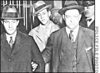Leopold, left, Darrow, and Loeb, officer in the rear