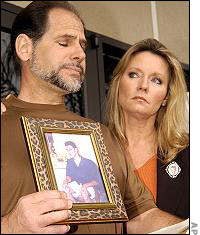 Nick's parents hold a photo of him
