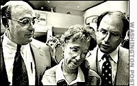 Ruthann Aron with her lawyers Barry Helfand, left, and Erik Bolog