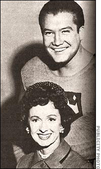 Noel Neill as Lois Lane posing with Reeves as Superman