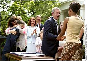 President Bush signs the federal Amber legislation.