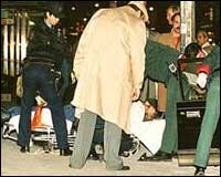 Paul Castellano on a stretcher after the assassination 