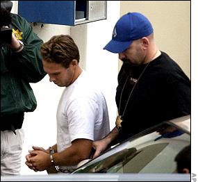 Jesse James Hollywod, cuffed, transported to court