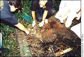 Agents removing the bodies form the scene