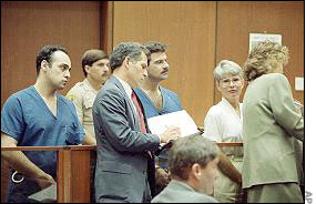 Alex Marti (left), William Mentzer (center, behind lawyer) and Karen Greenberger (right, facing camera)