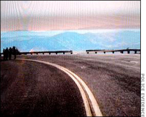 The damaged guardrail and area where the truck went over the side