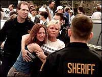 Woman embraces her daughter