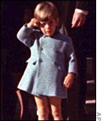 John F. Kennedy Jr. salutes casket