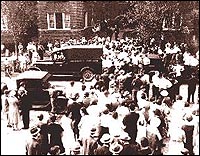 Crowd gathering outside Collingwood Manor apartments