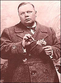 Roscoe 'Fatty' Arbuckle, poses in character