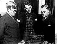 Attorneys examine the typewriter evidence