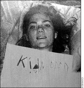 Mackle with "kidnapped" sign