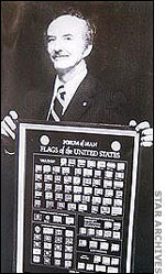 Kenneth Kimes Sr. holding Forum of Man poster 