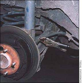 The Bonneville's brake line shows a set of vise grips sealing a brake line.