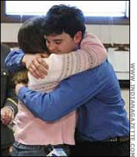 After the ordeal is over, Adam Silvis Hugs Oskins